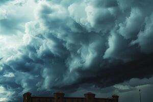 a very large storm moves in behind some buildings, photo