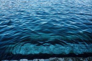 water sitting in deep with rocks in the middle, photo