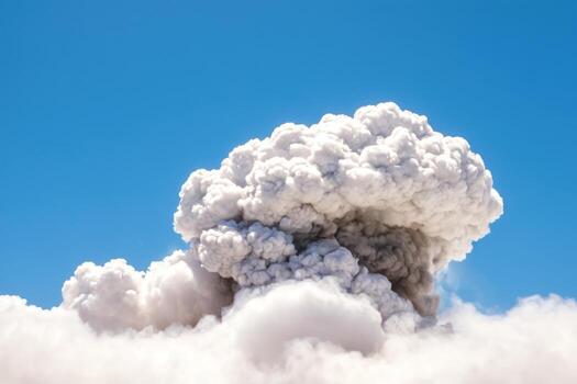 an open area with smoke and heavy white clouds in blue sky, photo