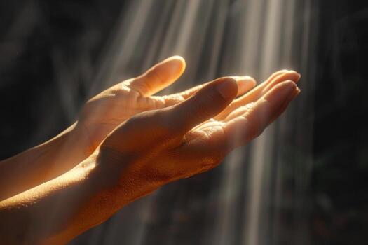 hand reaching towards sunlight with streams in background, photo