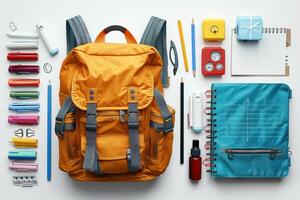 an opened backpack is being used to make school supplies, photo