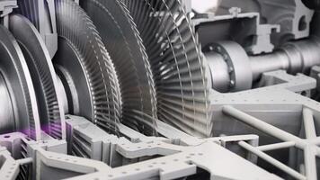 Rotating round parts in production machine. Media. Steam turbine generator at factory. Modern metal machines and generators. Gas or steam turbine generator video