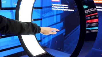 Virtual reality check. Media.A huge machine showing different icons from a computer that reacts to hand movements. video