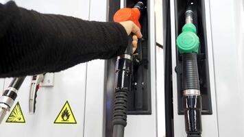 Gas station. Media.Cylinders with gasoline and gas are taken and then put in place for refueling the car. video