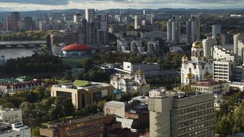 Top view of beautiful city with modern buildings on sunny summer day. Stock footage. Large modern city with variety of modern architecture. Beautiful modern city on summer day video