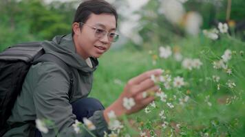 Man hiking in the wet forest Smiling and happiness Discover the tranquility and wonder of nature. video