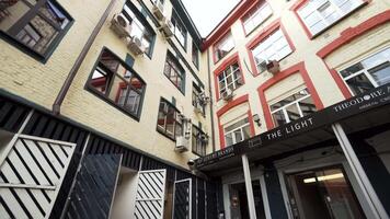 Usa, New York - June 12, 2022. Bottom view of a building with a shop or gallery. Action. Concept of architecture. video