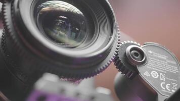Japan, Tokyo - June 9, 2022. Close-up automatic focus on professional camera. Action. Autofocus on camera with lens. Nikon lens on professional camera video