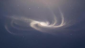 A tranquil and serene scene as cosmic dust particles gently float and swirl creating a sense of peacefulness in the expanse of space.. video