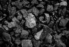 Black Coal Pile with Mining Background photo