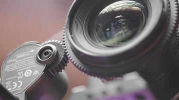 Japan, Tokyo - June 9, 2022. Close-up automatic focus on professional camera. Action. Autofocus on camera with lens. Nikon lens on professional camera video