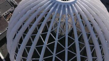 Aerial view of a lattice openwork structure consisting of semi arches. Stock footage. Modernism in architecture. video