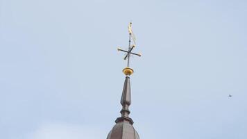 Low angle view of a building spire on a blue cloudy sky background. Action. Details of a classic dome. video