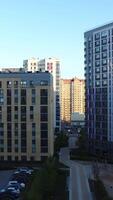 Top view of stylish architecture of modern district. Stock footage. Modern architecture of new residential buildings. Well-maintained residential area with multi-storey new houses video