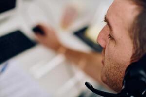 Close Up Portrait of a Customer Support Representative in a Call Center Environment. photo