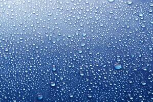 Blue Background with Water Drops on Glass photo
