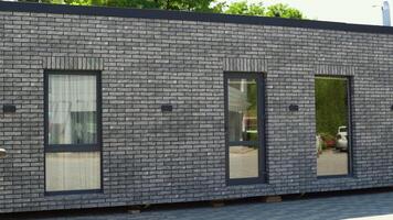 Exhibition of new and modern prefabricated modular house from composite wood panels. Energy efficient panel assembling video