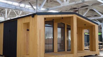 Newly built single storey prefabricated modular building. Prefabricated mobile wooden house at construction site video