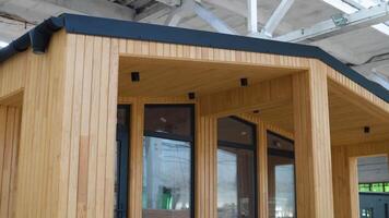 Exhibition of new and modern prefabricated modular house from composite wood panels. Energy efficient panel assembling video