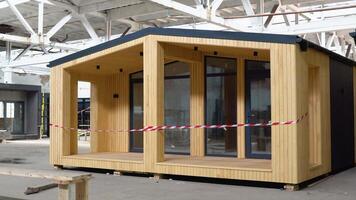 Exhibition of new and modern prefabricated modular house from composite wood panels. Energy efficient panel assembling video