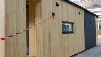 Exhibition of new and modern prefabricated modular house from composite wood panels. Energy efficient panel assembling video
