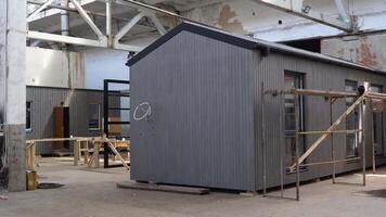 A new wooden modular prefabricated house inside an industrial building video