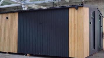 Exhibition of new and modern prefabricated modular house from composite wood panels. Energy efficient panel assembling video