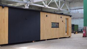 Exhibition of new and modern prefabricated modular house from composite wood panels. Energy efficient panel assembling video