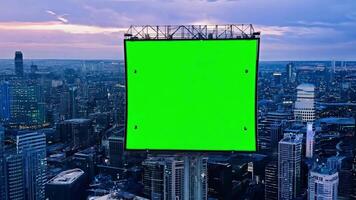 Top view of skyscrapers and green screen creation board with tracking points. Bird's eye view of modern city at night street video