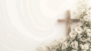 Composition with a Christian wooden cross and flowers against muted white background with space for text. Funeral invitation template photo