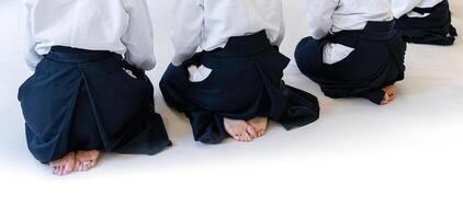 People practicing aikido in a dojo background. photo