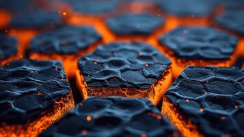 A close-up image of hexagonal shapes of molten rock with glowing orange edges. photo