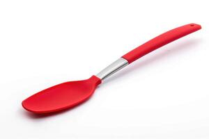 A red silicone spatula isolated on a white background. photo