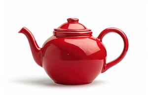 A red ceramic teapot isolated on a white background. photo