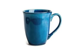 A blue ceramic mug isolated on a white background. photo