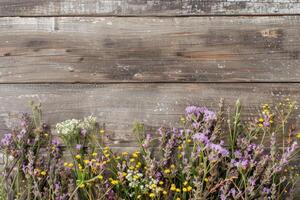 Rustic small flower bouquet with empty space on top. photo