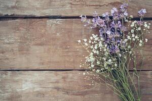 Rustic small flower bouquet with empty space on top. photo