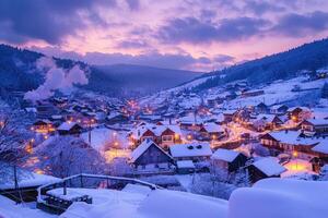 A snow-covered village at twilight with colorful lights photo
