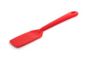 Red silicone spatula on a white background. photo