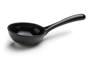 Black plastic soup ladle on a white background. photo