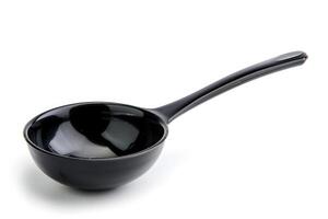 Black plastic soup ladle on a white background. photo