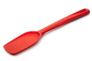 Red silicone spatula on a white background. photo