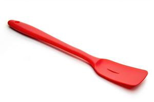 Red silicone spatula on a white background. photo