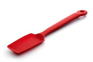 Red silicone spatula on a white background. photo