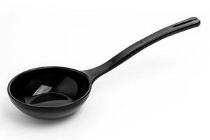 Black plastic soup ladle on a white background. photo