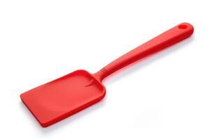 Red silicone spatula on a white background. photo