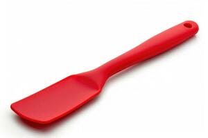 Red silicone spatula on a white background. photo