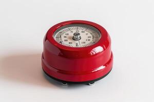 Red kitchen timer on a white background. photo