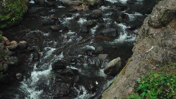 Serene River Flowing Over Rocks video
