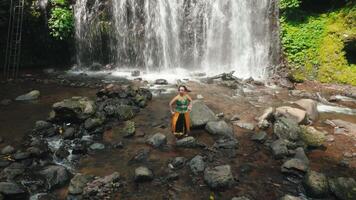 Dancer by the Waterfall in Traditional Attire video